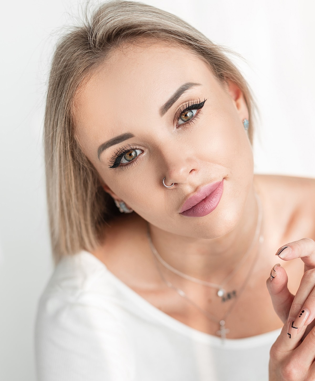 Close-up of a woman with styled hair.